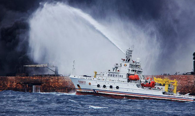 Chinese firefighters struggle to put out fire at stricken oil tanker