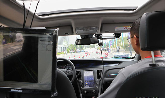 Driverless car runs during DIY Robocars challenge in SW China