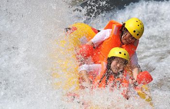 Water brings coolness to people in scorching summer