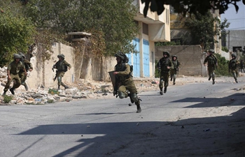 Israeli soldiers clash with Palestinian protesters near West Bank city of Nablus